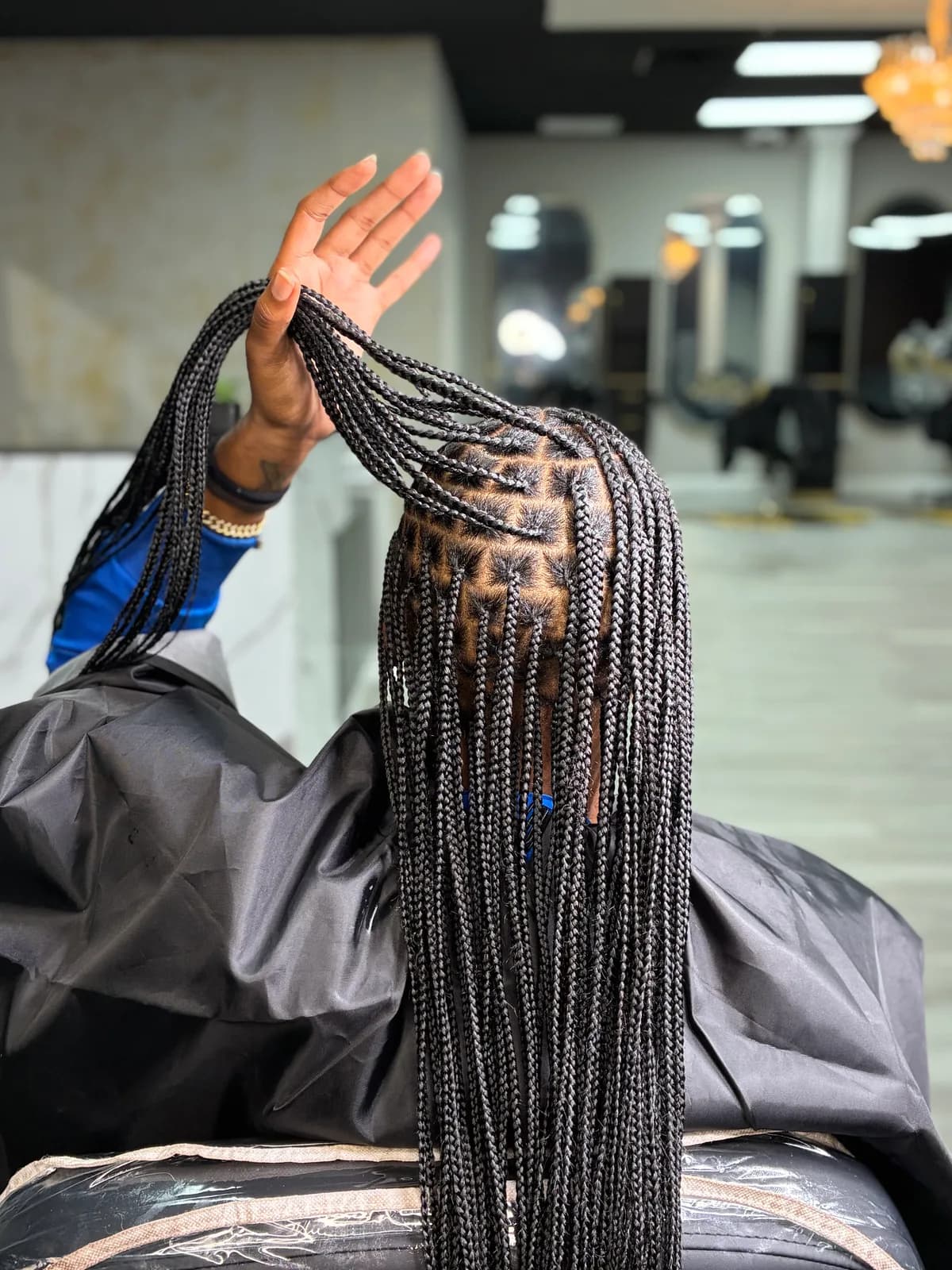Close view of clean parts and long black braids